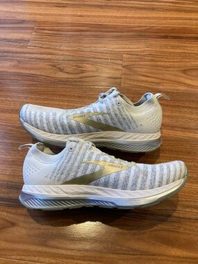 Brooks Women's White and Light Gray Athletic Running Shoes with Gold Logo
